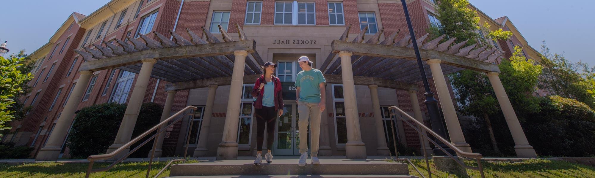 male and female student outside Stokes Hall